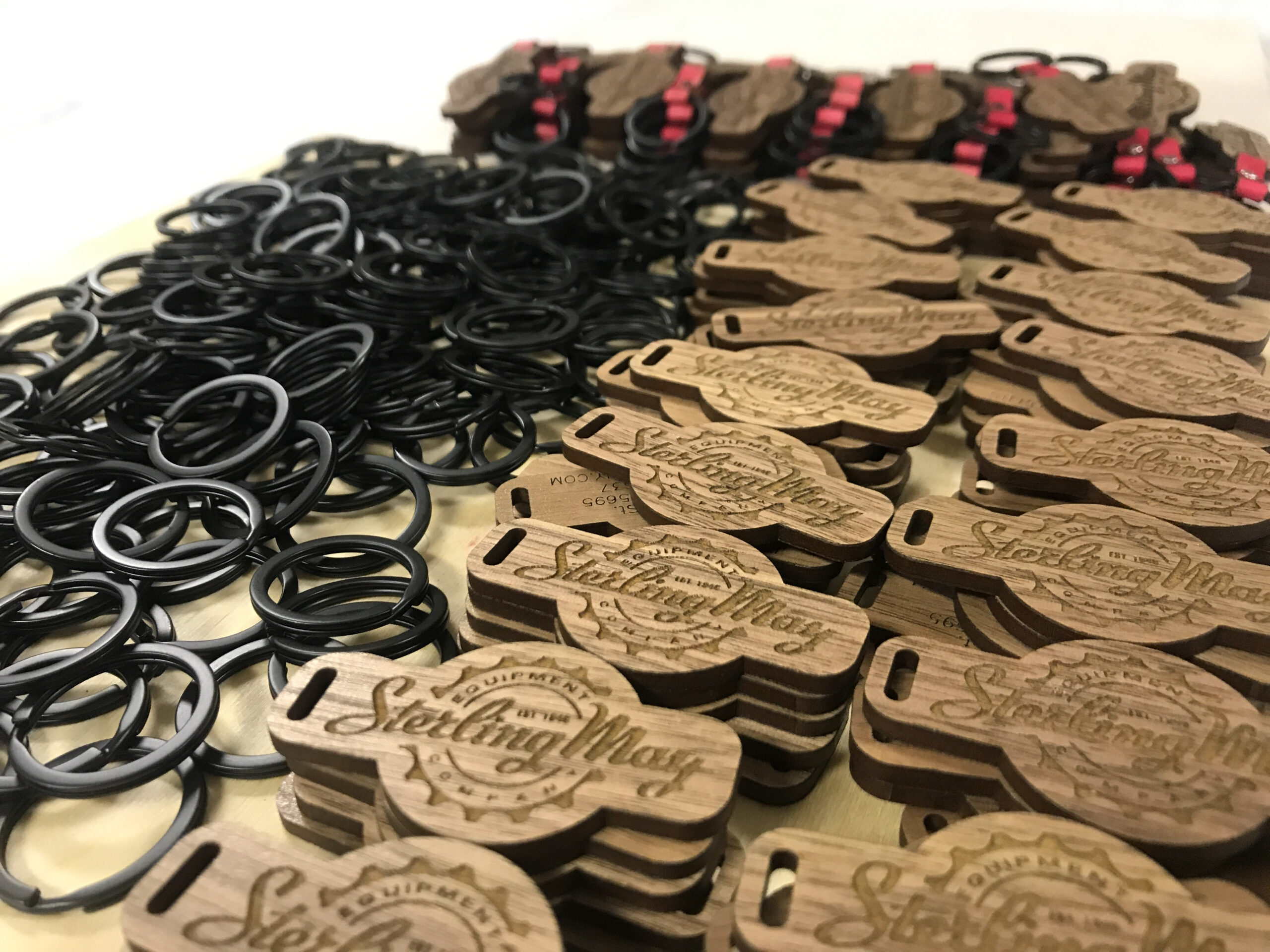 a stack of laser-engraved keychains