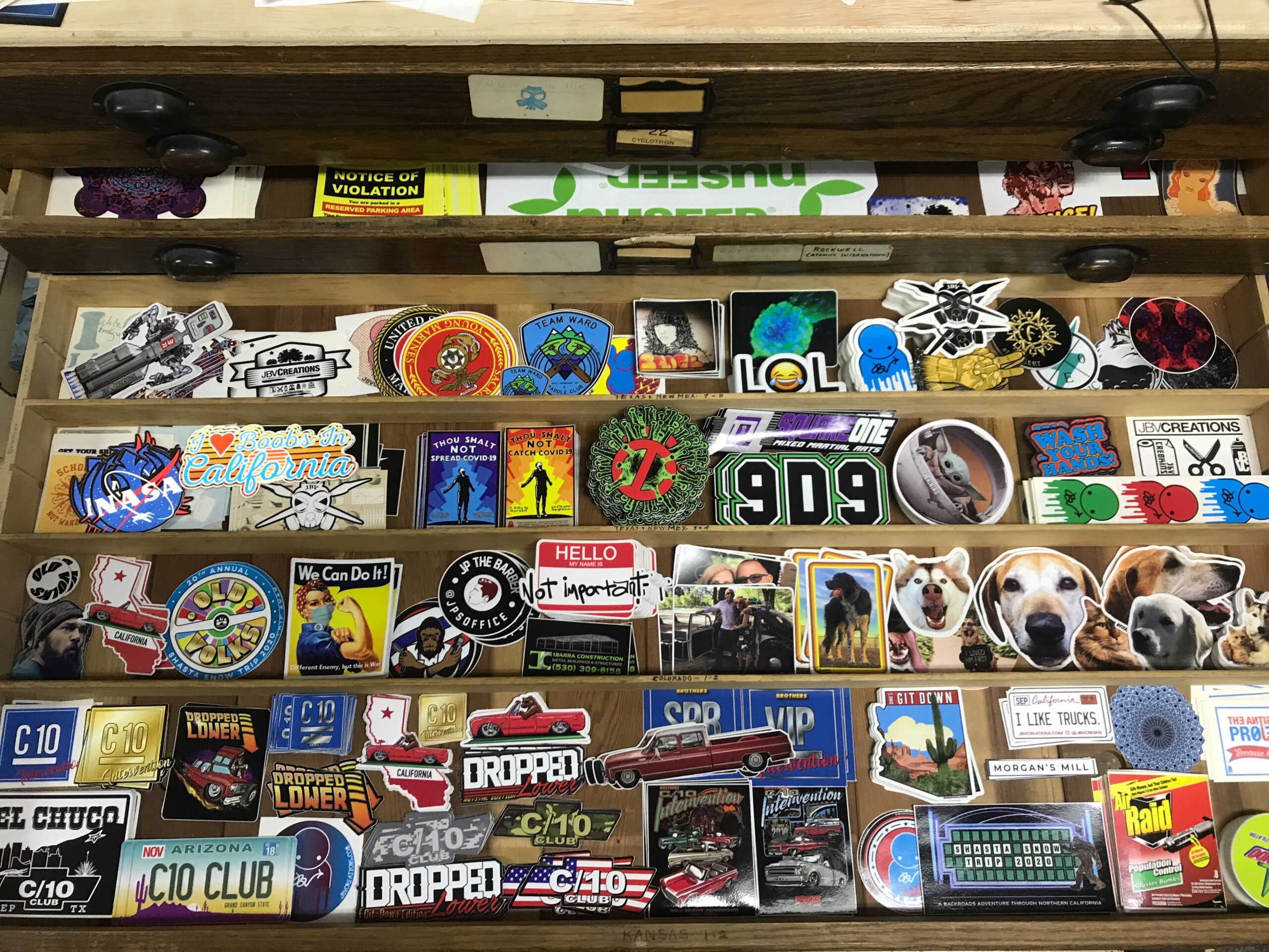 graphic stickers displayed on a shelf.